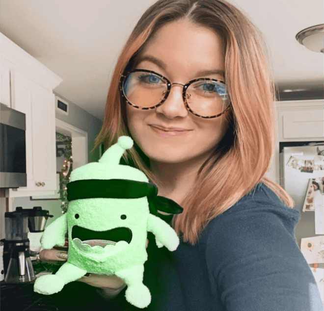 woman showing a mojo plush