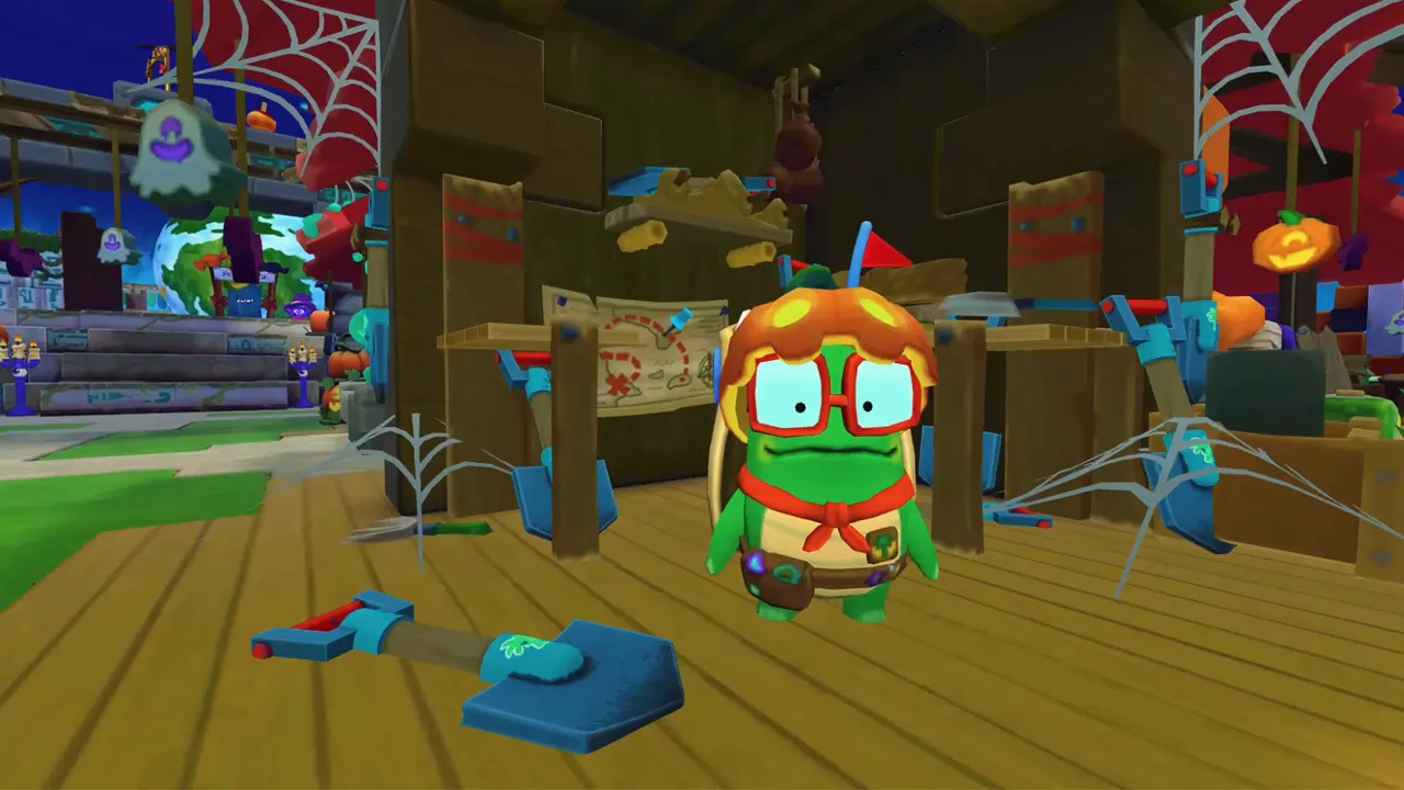 A camp character wearing a pumpkin hat and big round glasses, standing at a cobwebbed stall.