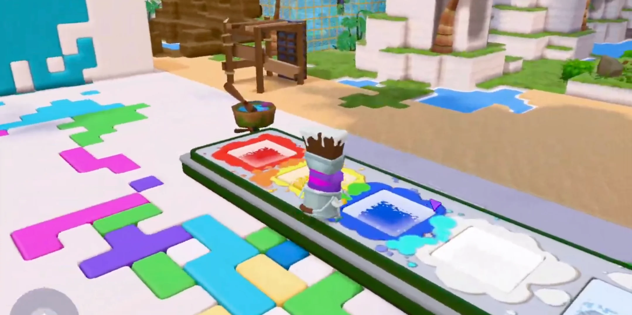Players mid-air splattering color across a giant sculpture