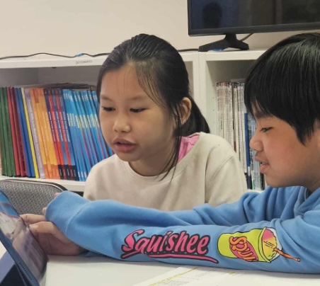Parent helping child with tutoring session
