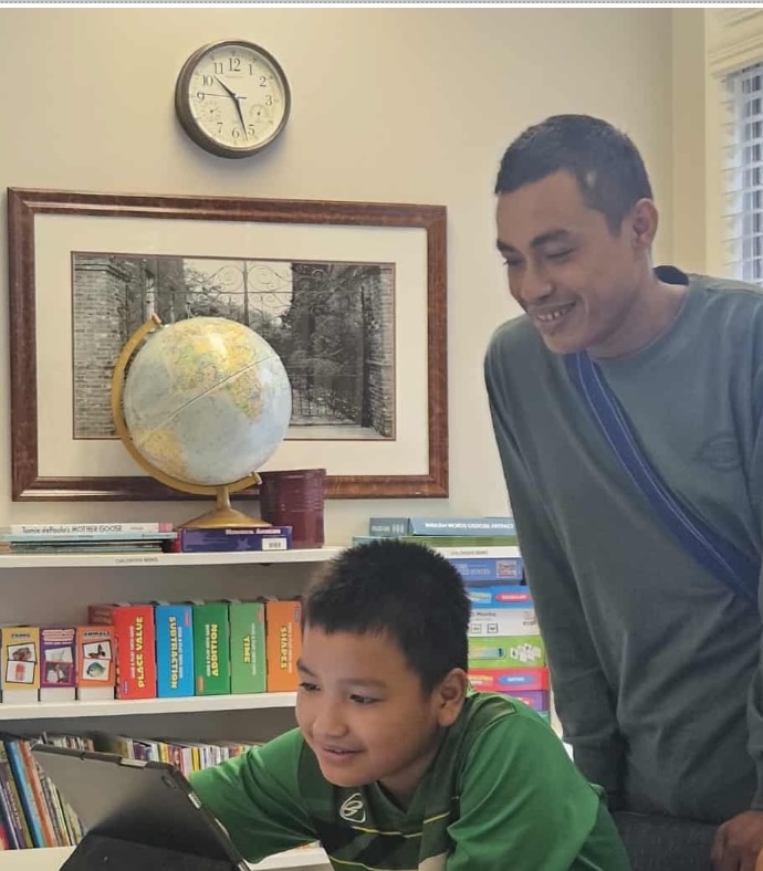 Father and son during tutoring lesson